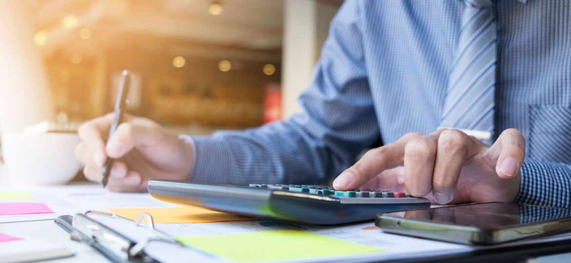 Business finance man calculating budget numbers, Invoices and fi